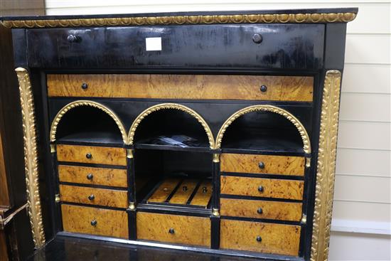 A pair of early 19th Biedermeier ebonised and ormolu cabinets; one a cabinet the other a secretaire a abbatant W.110cm